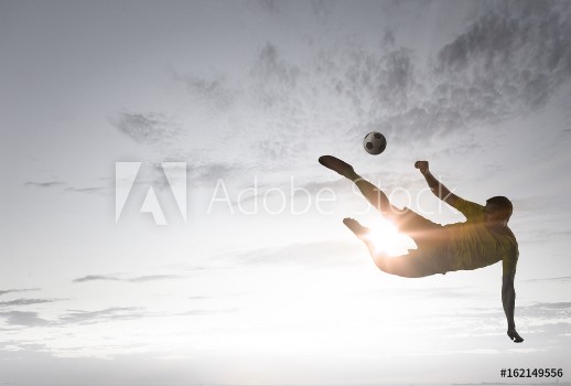 Picture of Soccer player with ball outdoors
